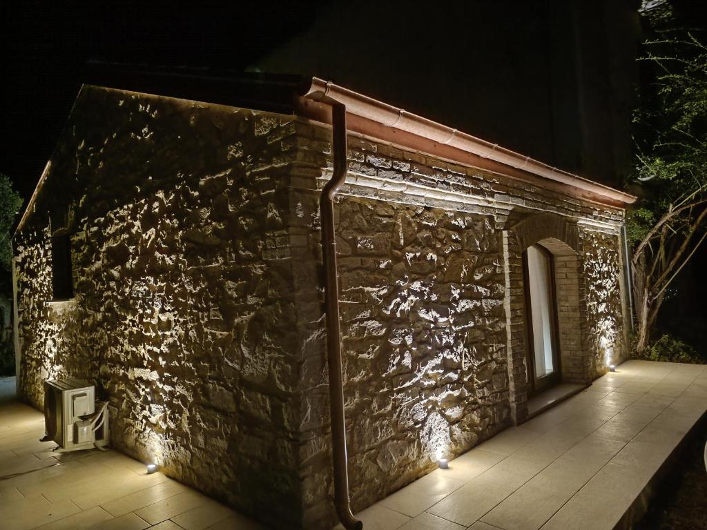 a stone building with lights on it at night at OH QUANT’E’ BELLA L’ACQUABELLA in Ortona
