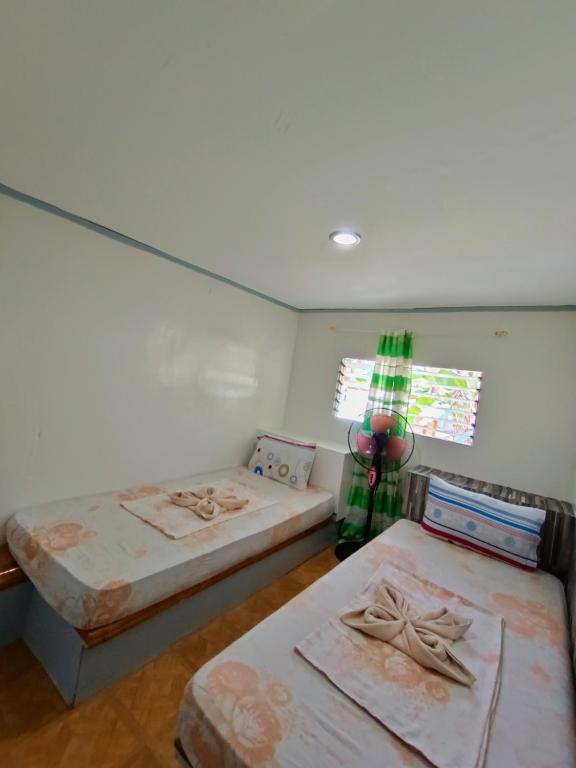 Postel nebo postele na pokoji v ubytování Ander Divers Garden Resort