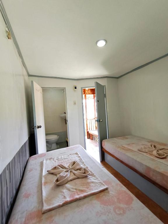 Postel nebo postele na pokoji v ubytování Ander Divers Garden Resort