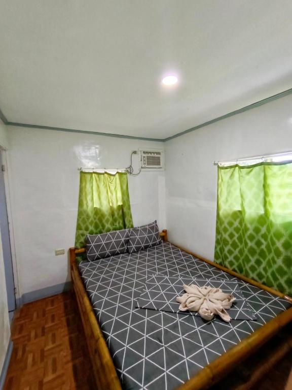 Postel nebo postele na pokoji v ubytování Ander Divers Garden Resort