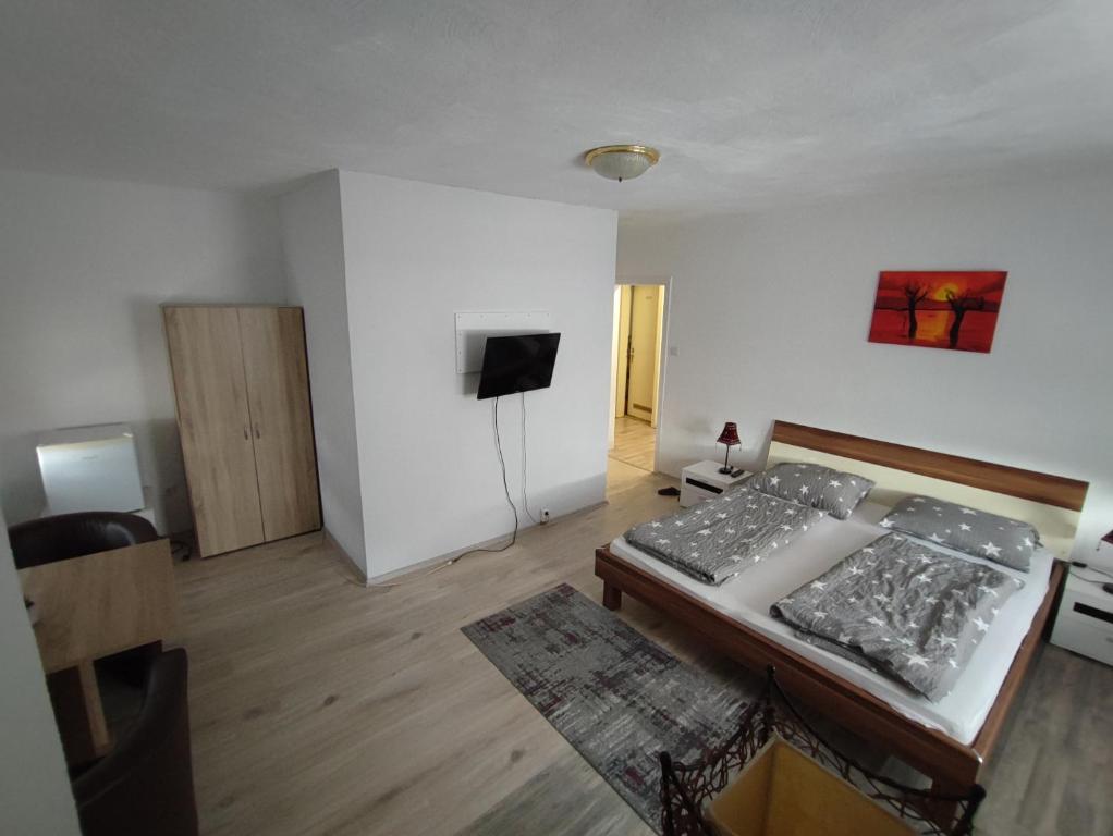 Postel nebo postele na pokoji v ubytování Hotel Gambrinus