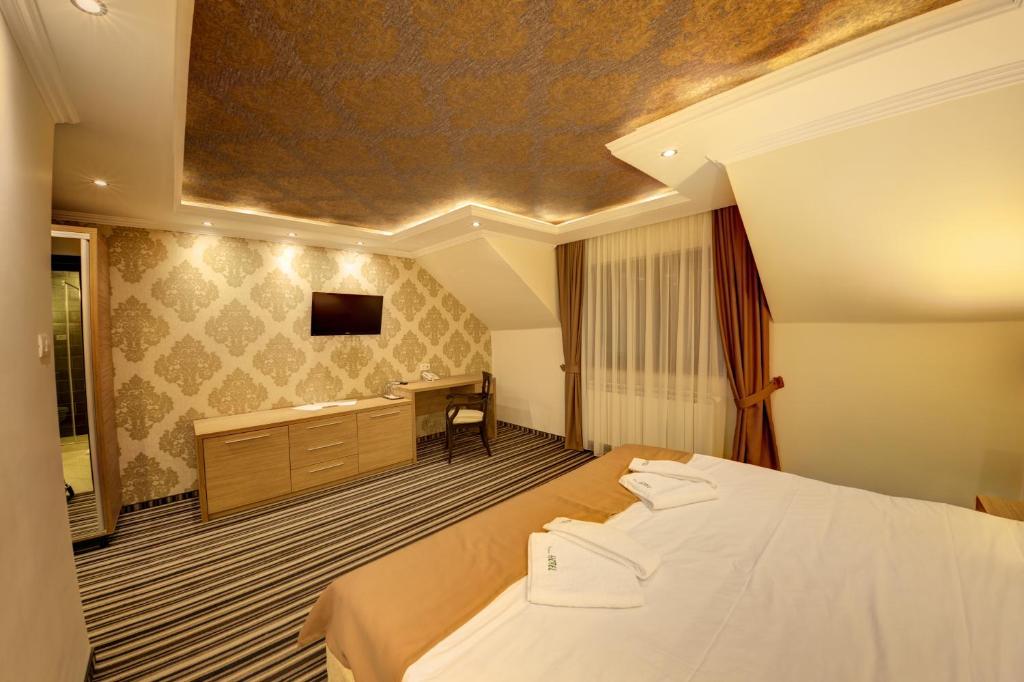 Postel nebo postele na pokoji v ubytování Allegria Hotel