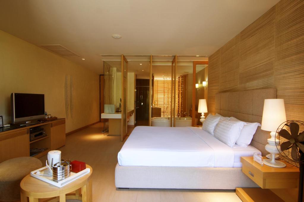 Postel nebo postele na pokoji v ubytování Dune Hua Hin Hotel