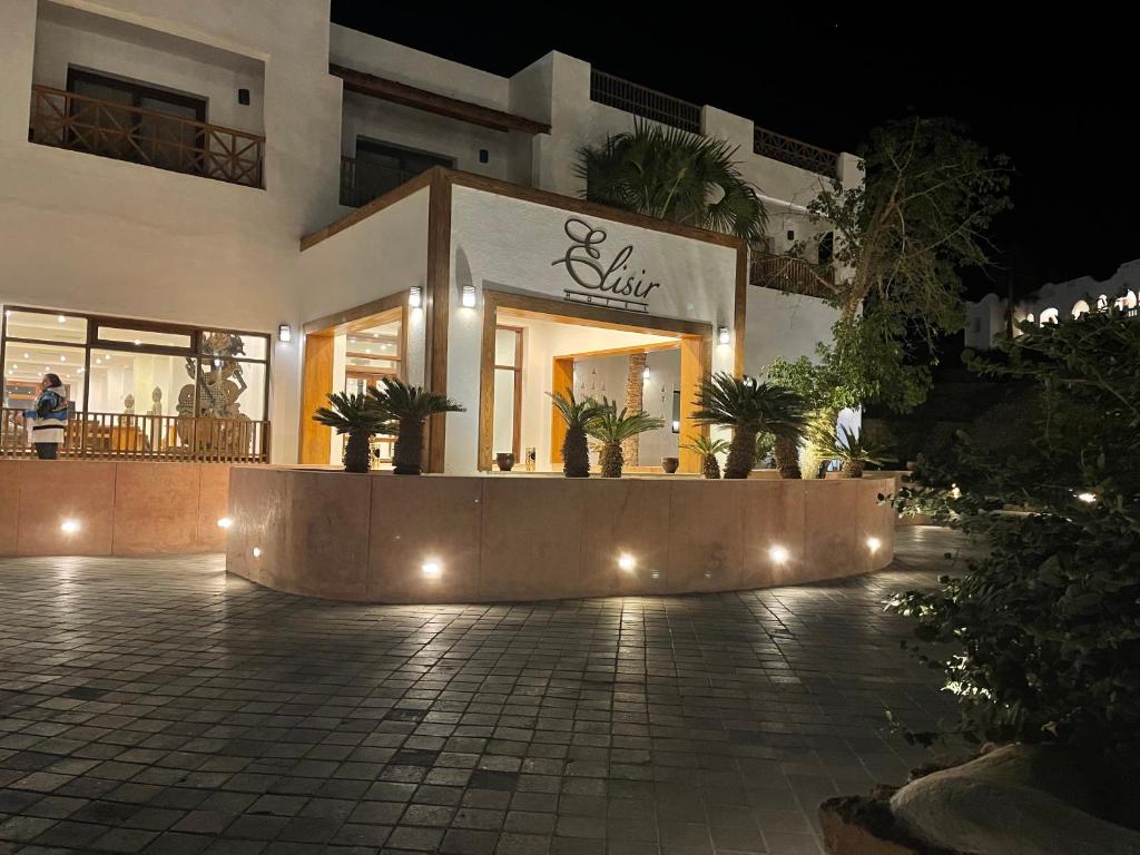 a store front of a building at night at Sheikh coast in Sharm El Sheikh