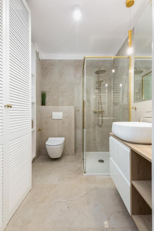 Kúpeľňa v ubytovaní Seaside Apartamenty Porta Mare I Kołobrzeg