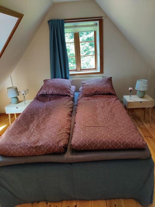 Postel nebo postele na pokoji v ubytování Stuga i natursköna mittskåne