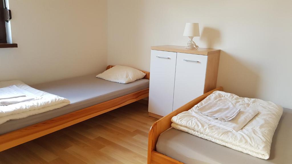 Posteľ alebo postele v izbe v ubytovaní Domki letniskowe,apartamenty Wczasowa 8a