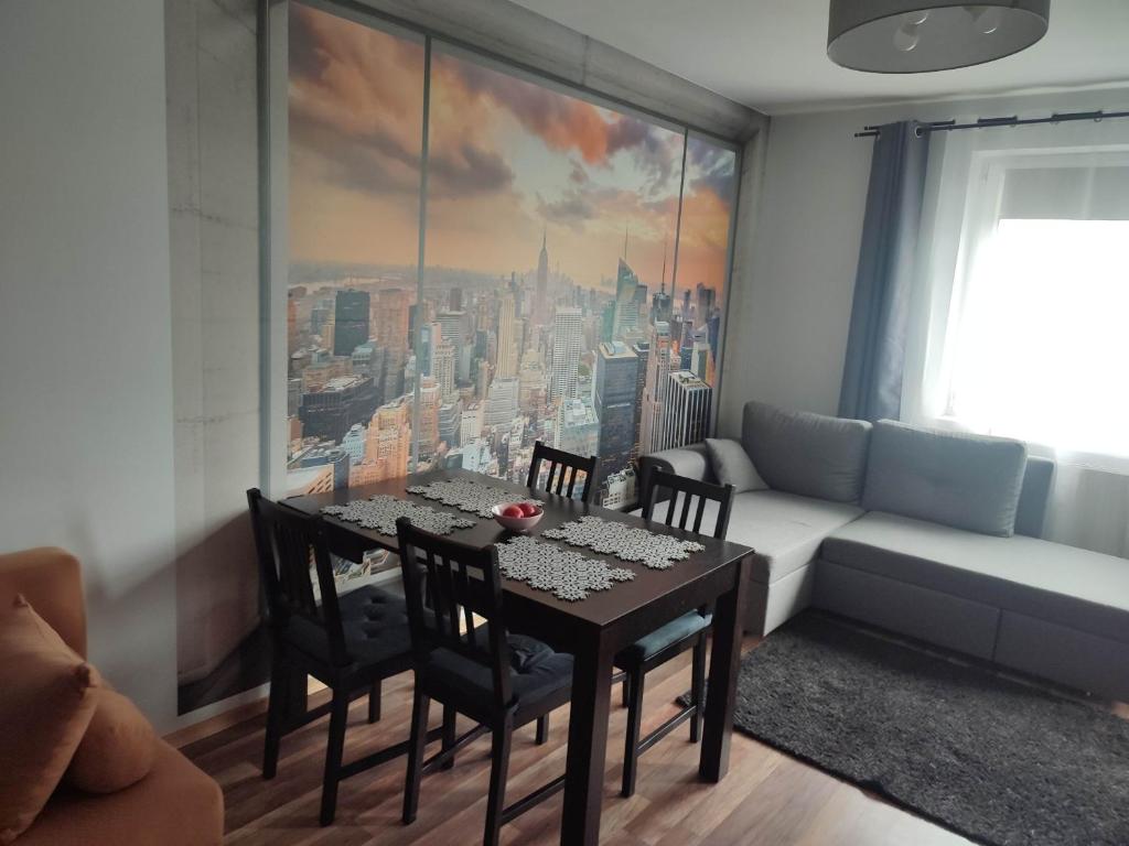 a living room with a table and a couch at Warsaw Apartment Iwona - all 45m2 - close to the centre in Warsaw