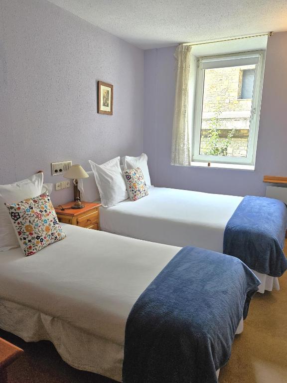 Posteľ alebo postele v izbe v ubytovaní Hotel Anglada