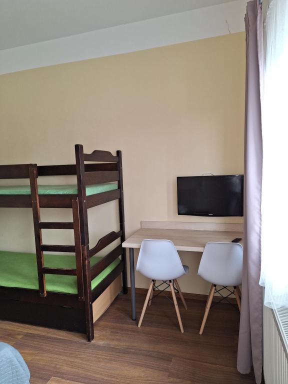 Postel nebo postele na pokoji v ubytování Omega Jantar
