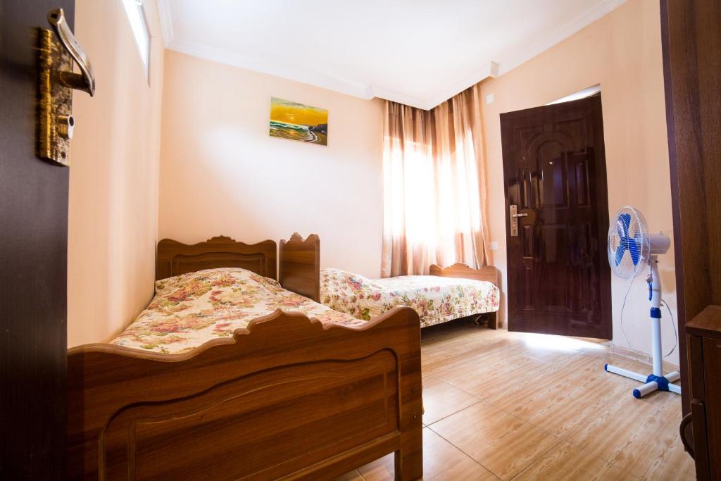 Postel nebo postele na pokoji v ubytování Guest House Rimma