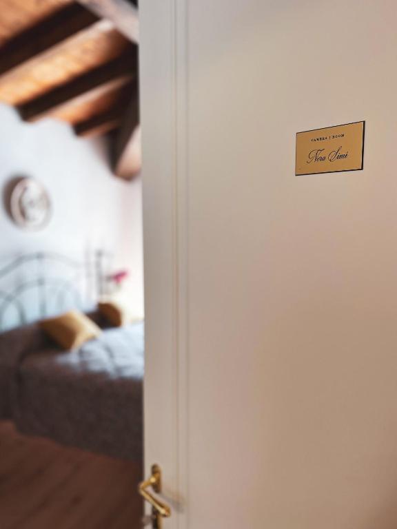 Postel nebo postele na pokoji v ubytování L'Antico Asilo