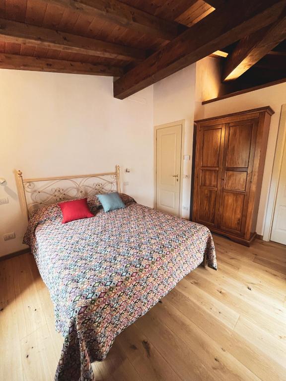 Postel nebo postele na pokoji v ubytování L'Antico Asilo
