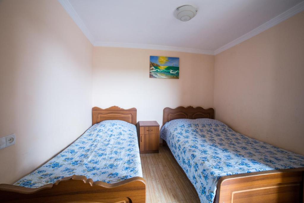 Postel nebo postele na pokoji v ubytování Guest House Rimma