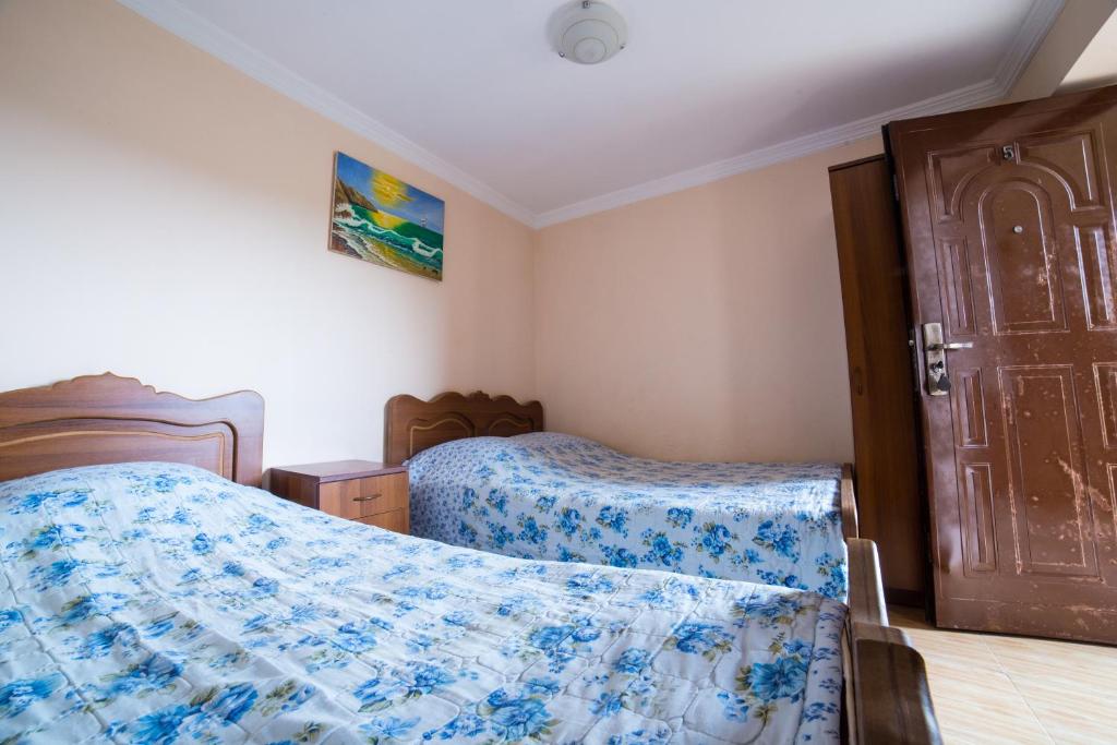 Postel nebo postele na pokoji v ubytování Guest House Rimma