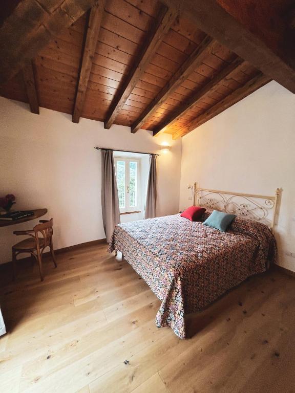 Postel nebo postele na pokoji v ubytování L'Antico Asilo