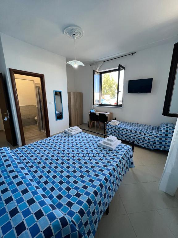 Katil atau katil-katil dalam bilik di Vico del Sole