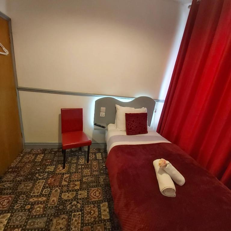 Postel nebo postele na pokoji v ubytování St Albans Guest House, Dover