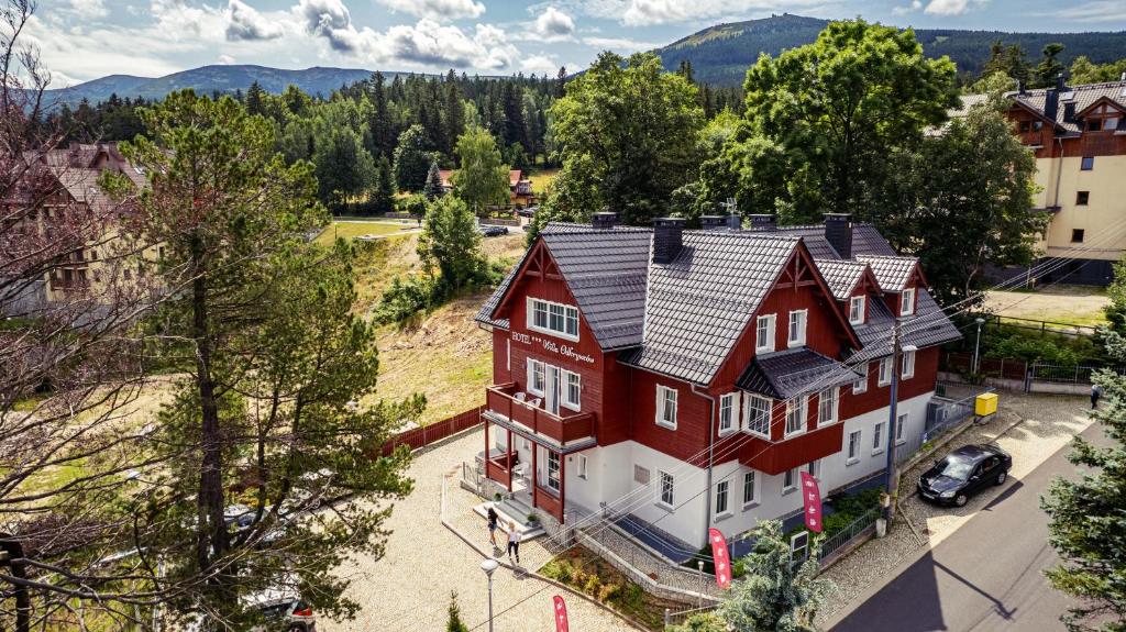 an aerial view of a large red and white house at Hotel Willa Odkrywców in Szklarska Poręba