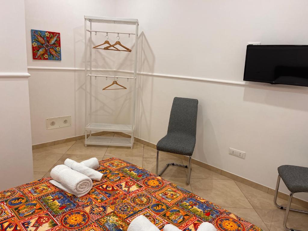 Postel nebo postele na pokoji v ubytování Esse House's Noto