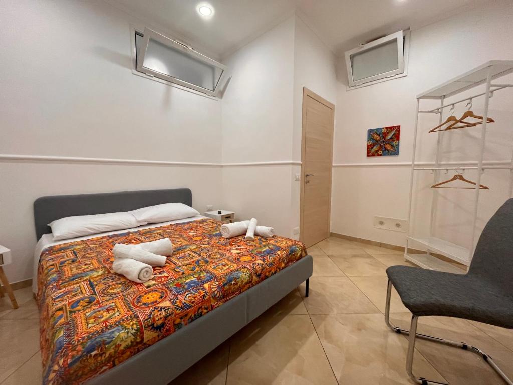 Postel nebo postele na pokoji v ubytování Esse House's Noto