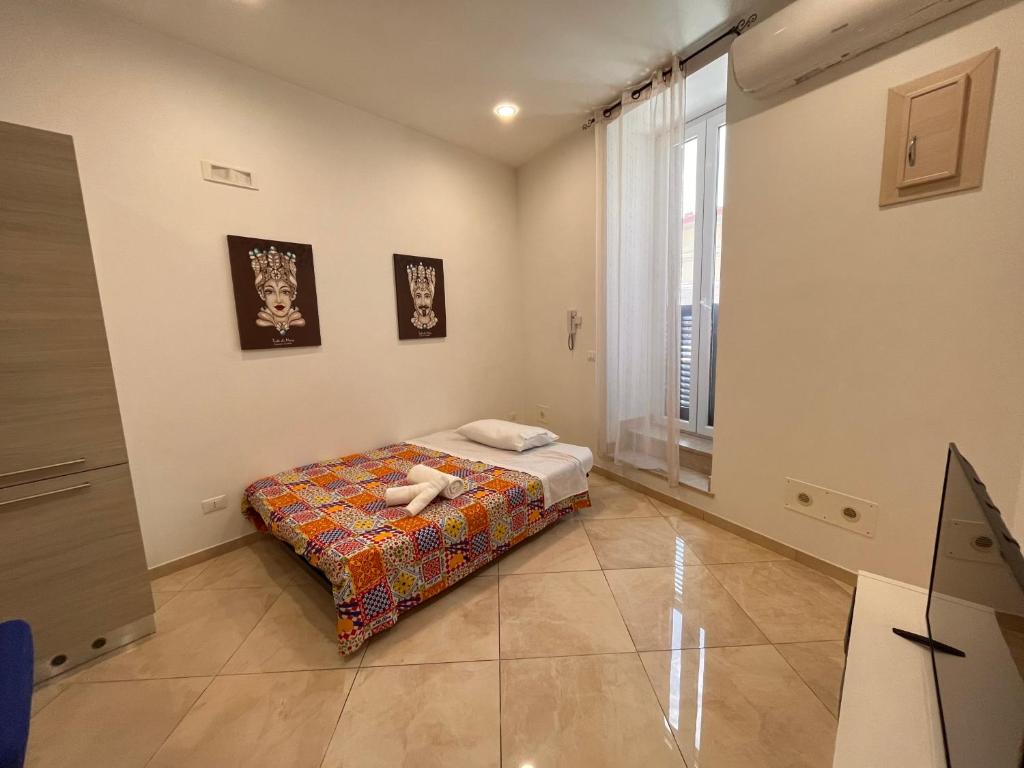 Postel nebo postele na pokoji v ubytování Esse House's Noto