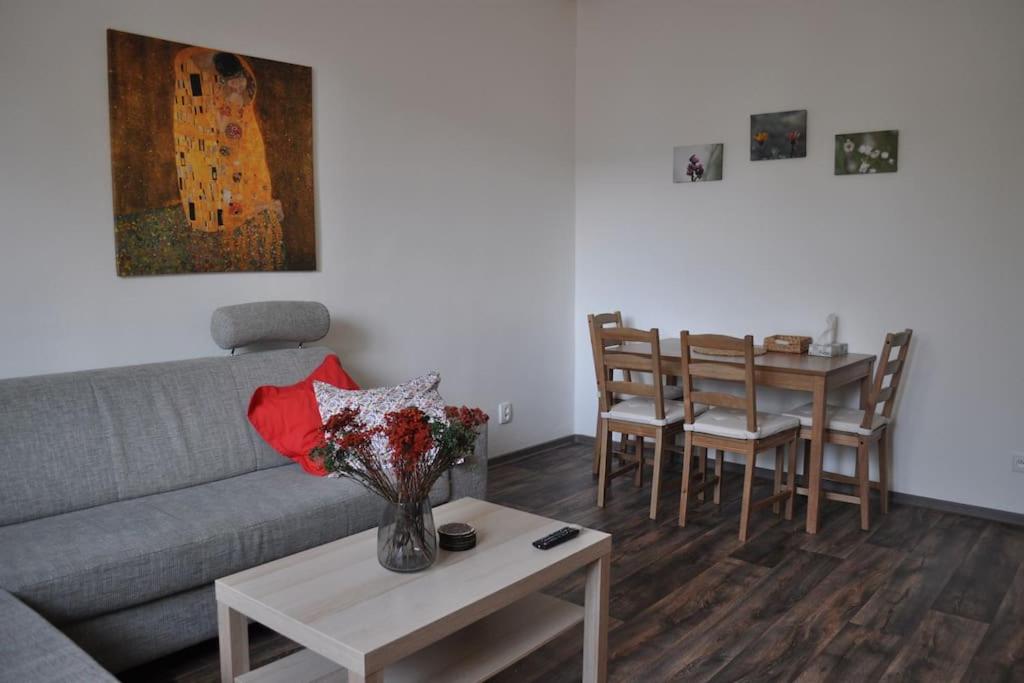 a living room with a couch and a table at Apartment in Praha 3 in Prague