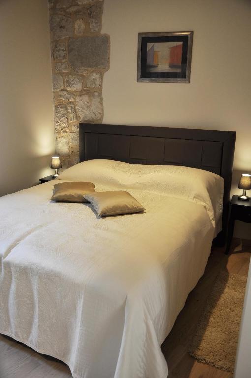 Postel nebo postele na pokoji v ubytování Villa Stagnja