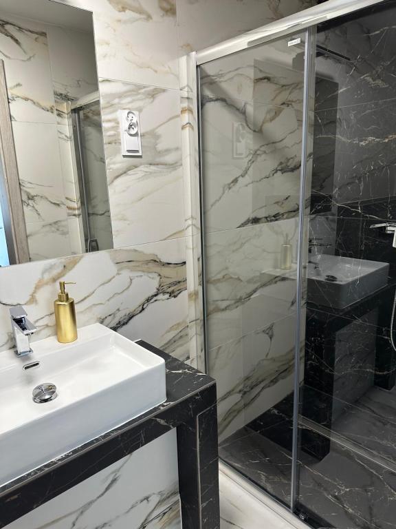 Koupelna v ubytování Roomflacja