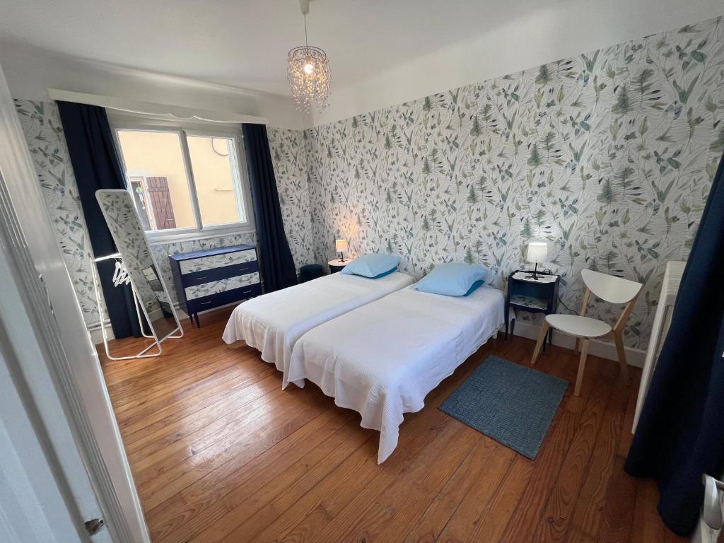 Llit o llits en una habitació de Maison Chez Marinette
