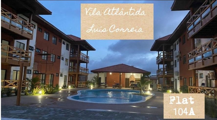 a picture of an apartment complex with a swimming pool at FLAT 104 Luis Correia Vila Atlântida in Luis Correia