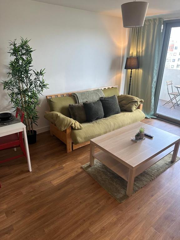 a living room with a couch and a coffee table at Entire 2 bedroom flat in London