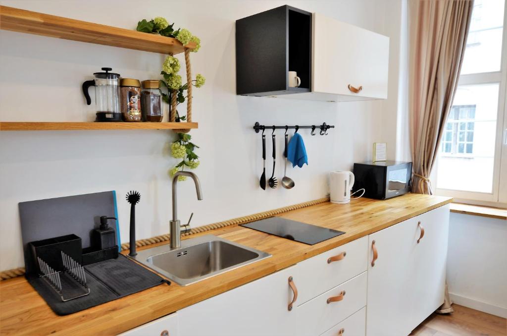 Kuchyňa alebo kuchynka v ubytovaní Apartament Szeroka Old Town