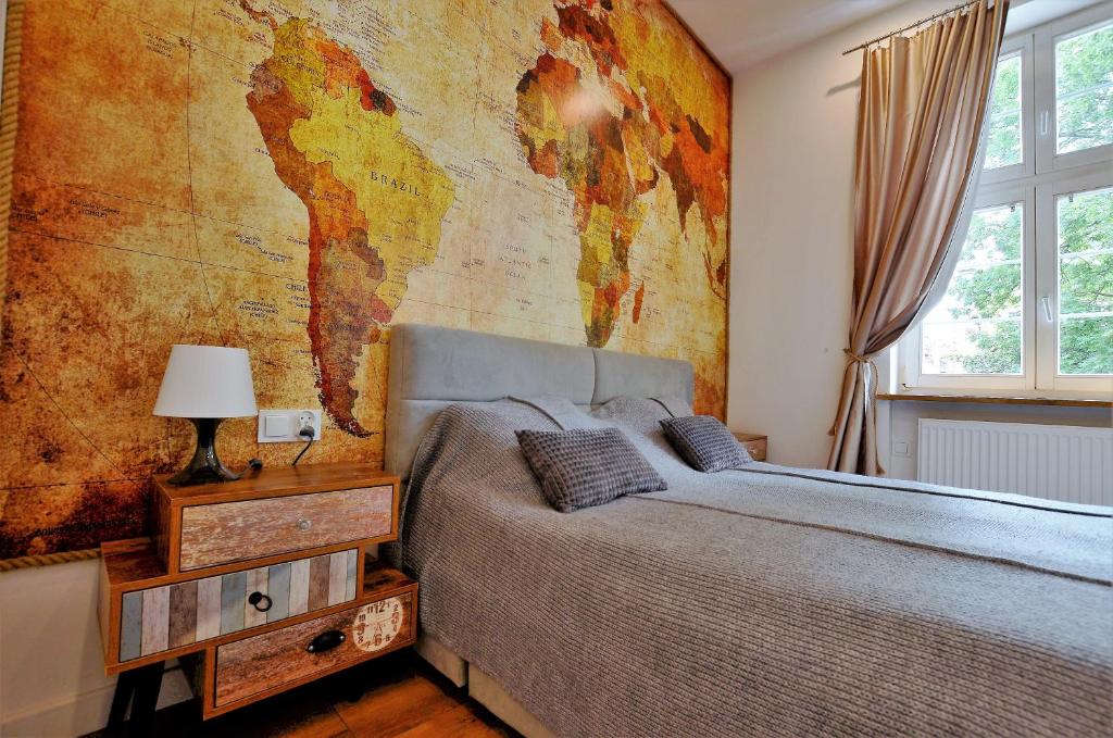 Posteľ alebo postele v izbe v ubytovaní Apartament Szeroka Old Town