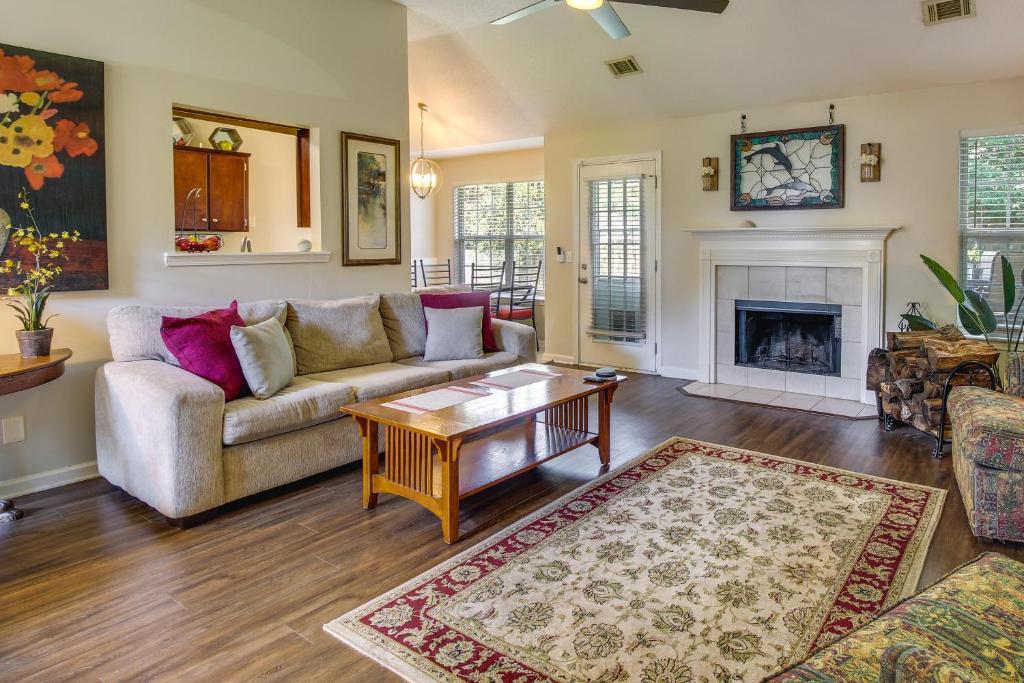 a living room with a couch and a fireplace at Pet-Friendly Savannah Rental with Community Pool! in Savannah