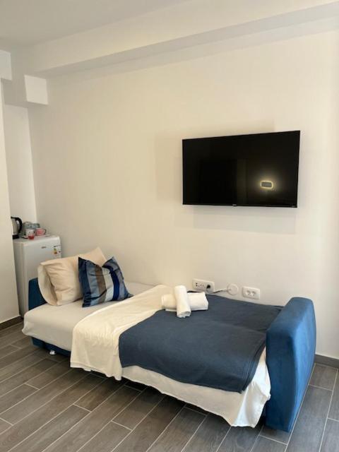 Postel nebo postele na pokoji v ubytování Naomi Rooms