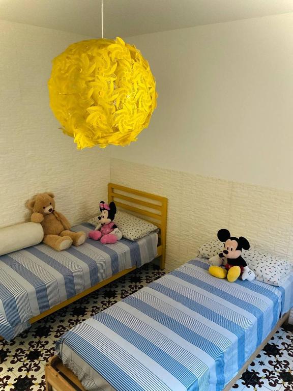 Łóżko lub łóżka w pokoju w obiekcie Residenza Gli Oleandri