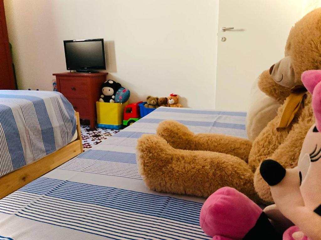 Łóżko lub łóżka w pokoju w obiekcie Residenza Gli Oleandri