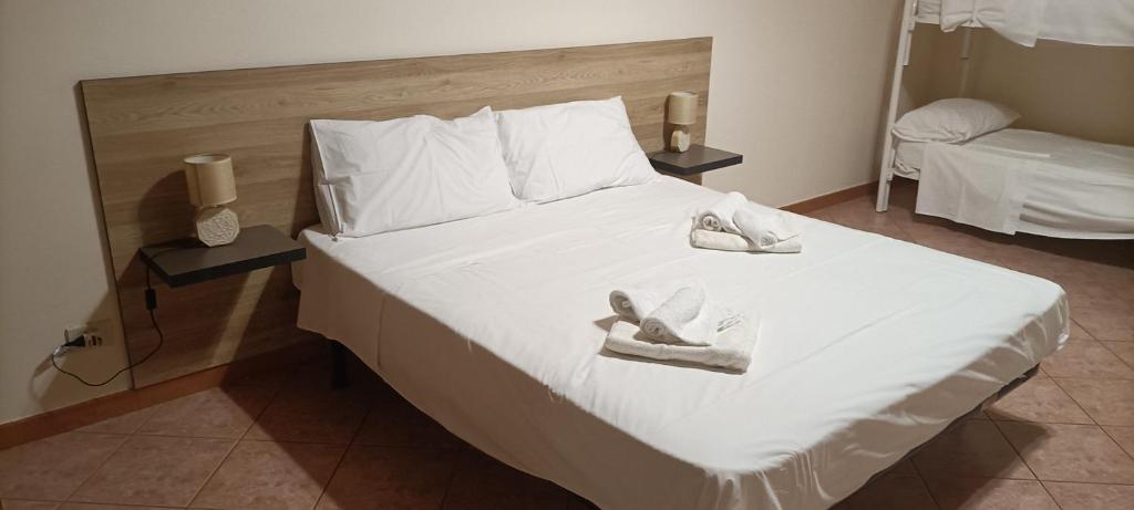 Posteľ alebo postele v izbe v ubytovaní Casa Vacanze Vita 1