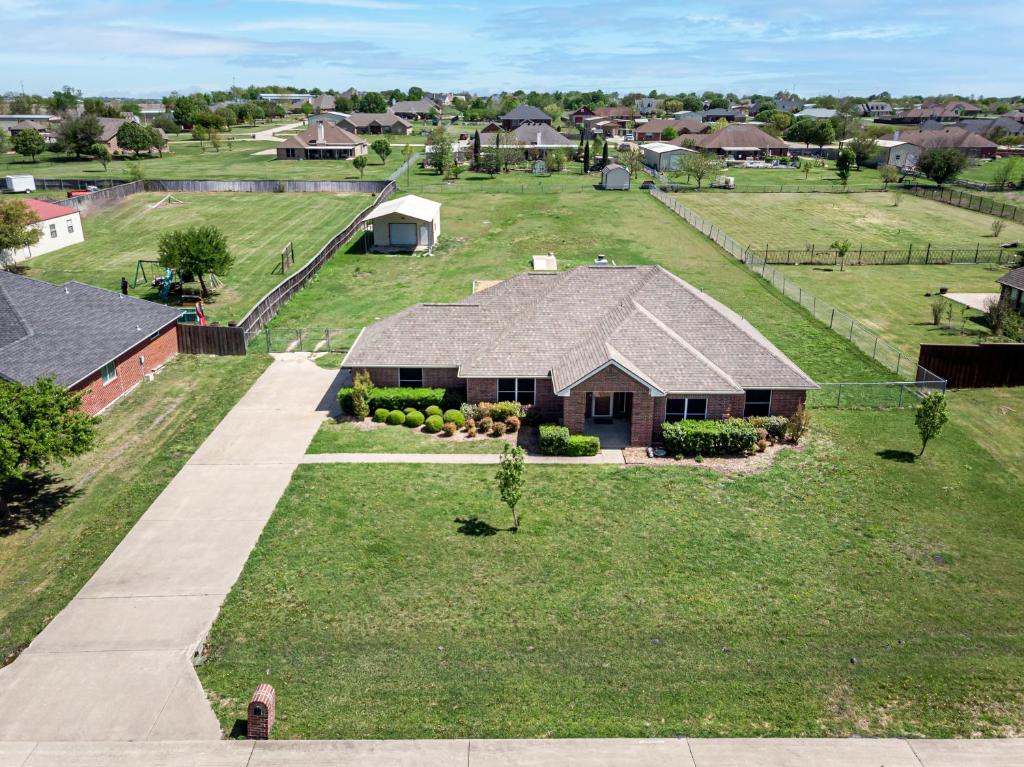 an aerial view of a house with a large yard at Perfect Stay in Ranch-like House w Huge Backyard! in Forney