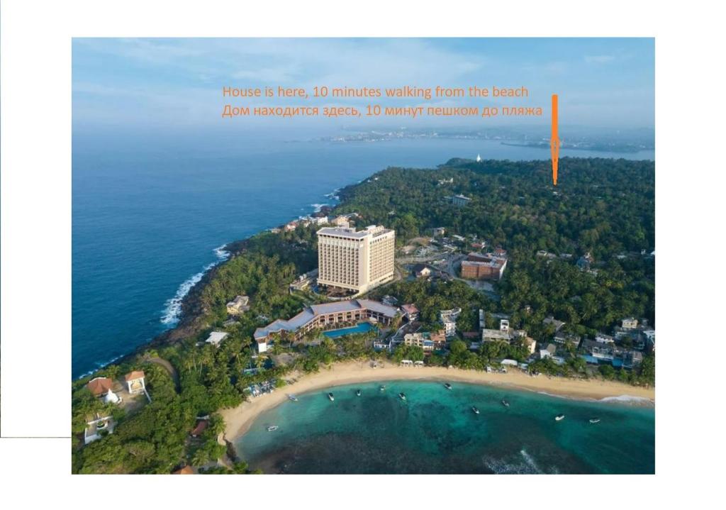 a picture of a resort on a island in the ocean at Rawanaz in Unawatuna