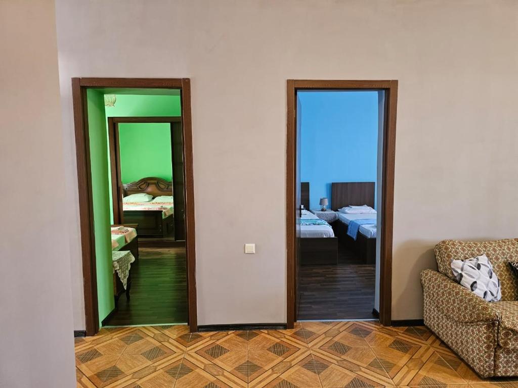 Postel nebo postele na pokoji v ubytování Guest House AMO
