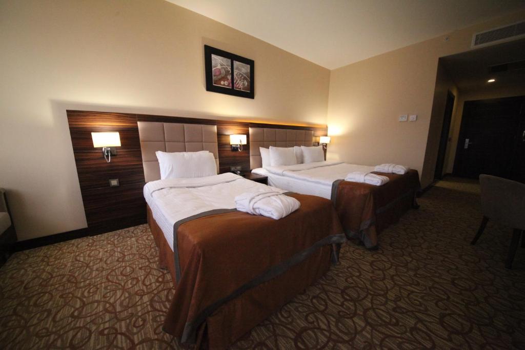 Postel nebo postele na pokoji v ubytování Safa Sorgun Thermal Hotel