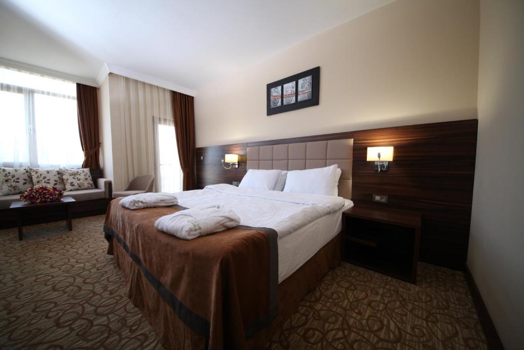 Postel nebo postele na pokoji v ubytování Safa Sorgun Thermal Hotel