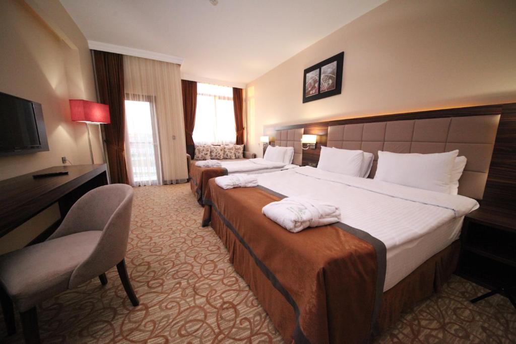 Postel nebo postele na pokoji v ubytování Safa Sorgun Thermal Hotel