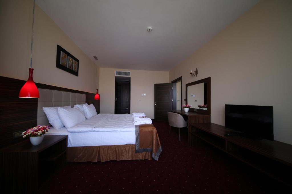 Postel nebo postele na pokoji v ubytování Safa Sorgun Thermal Hotel