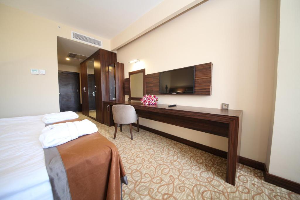 Postel nebo postele na pokoji v ubytování Safa Sorgun Thermal Hotel