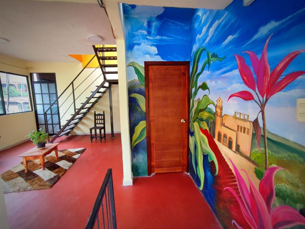 a hallway with a painting on the wall at DEPARTAMENTO EL PARAISO in Xilitla
