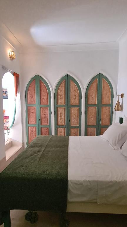 Postel nebo postele na pokoji v ubytování Riad la Cigale