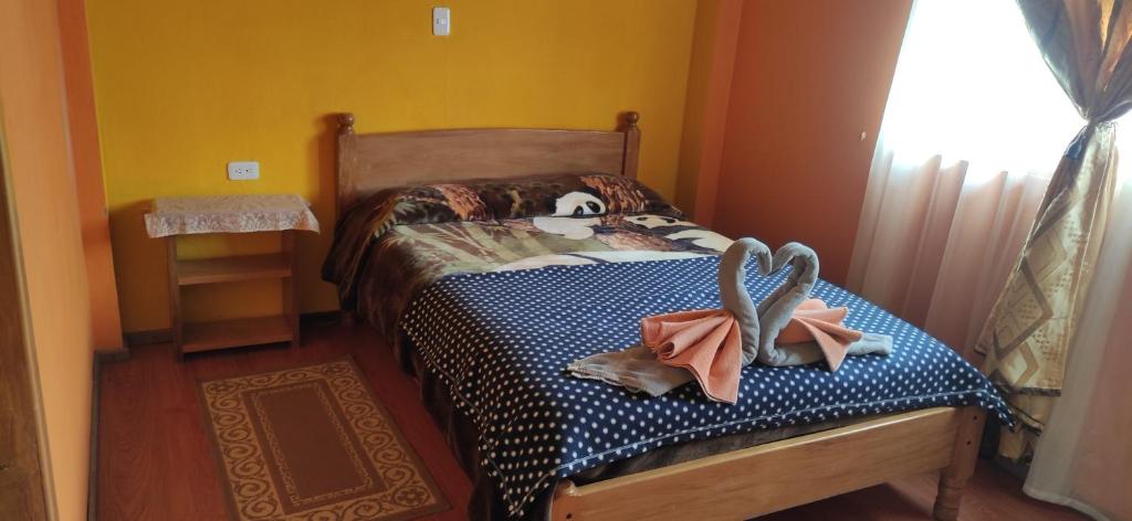 Postel nebo postele na pokoji v ubytování Hostal el Vaquero